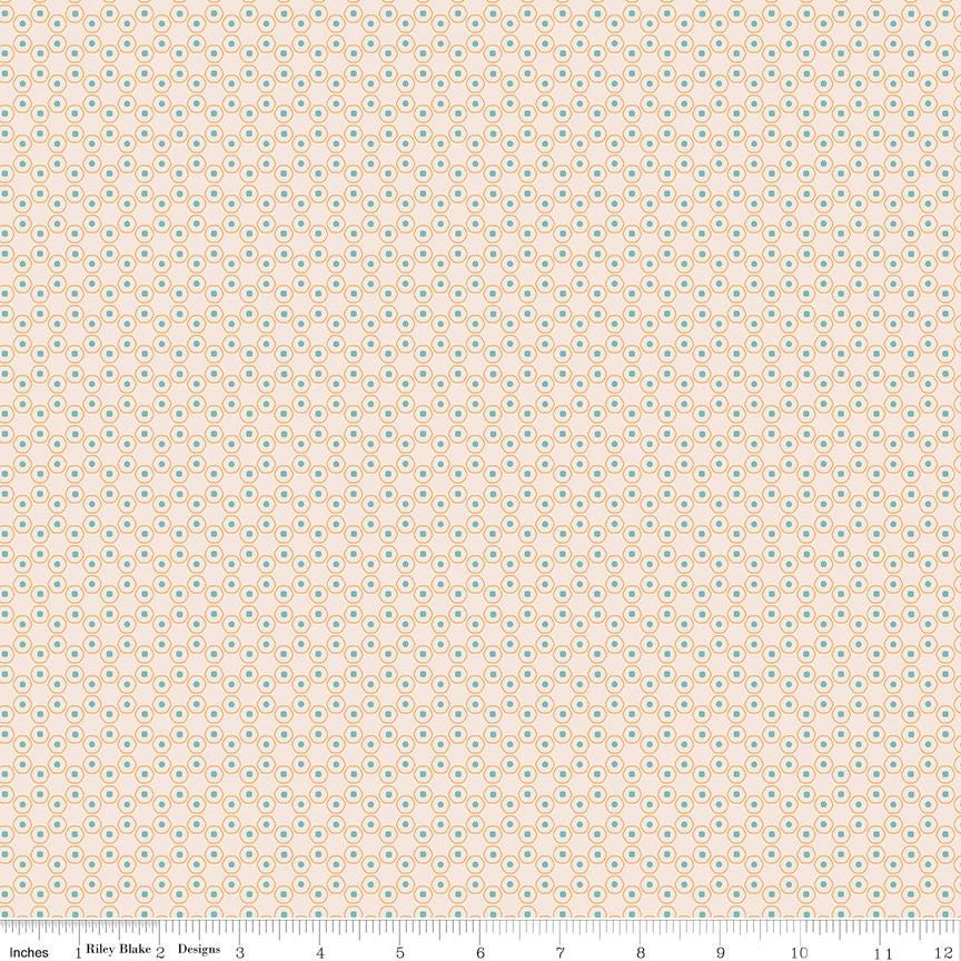 a beige background with small blue and green dots
