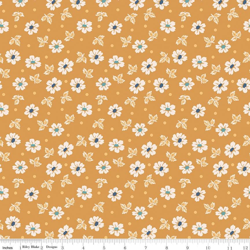 an orange background with white and blue flowers