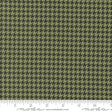 a ruler with a green and black hounds pattern on it