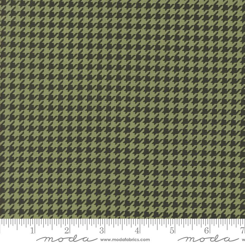 a ruler with a green and black hounds pattern on it