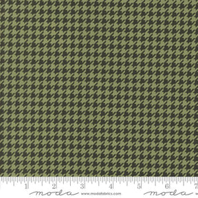 a ruler with a green and black hounds pattern on it