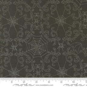 a black background with white spider webs on it