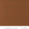 an orange and black checkered fabric with a ruler