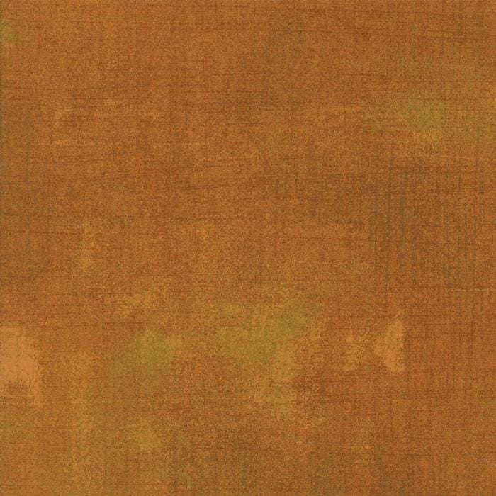 The image is a textured surface with a warm, earthy color palette.