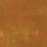The image is a textured surface with a warm, earthy color palette.