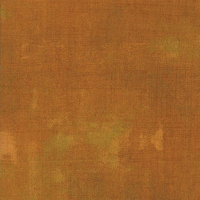 The image is a textured surface with a warm, earthy color palette.