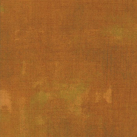 The image is a textured surface with a warm, earthy color palette.