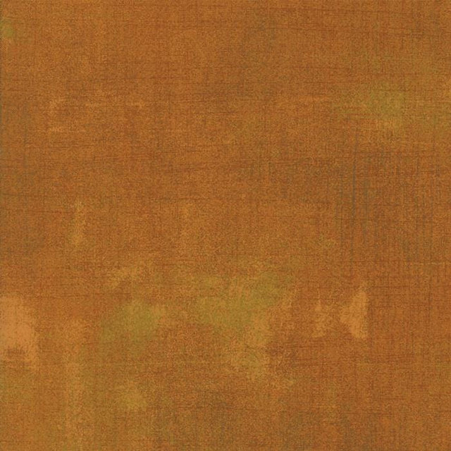 The image is a textured surface with a warm, earthy color palette.