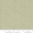 a repeating pattern of green circles on a fabric surface.