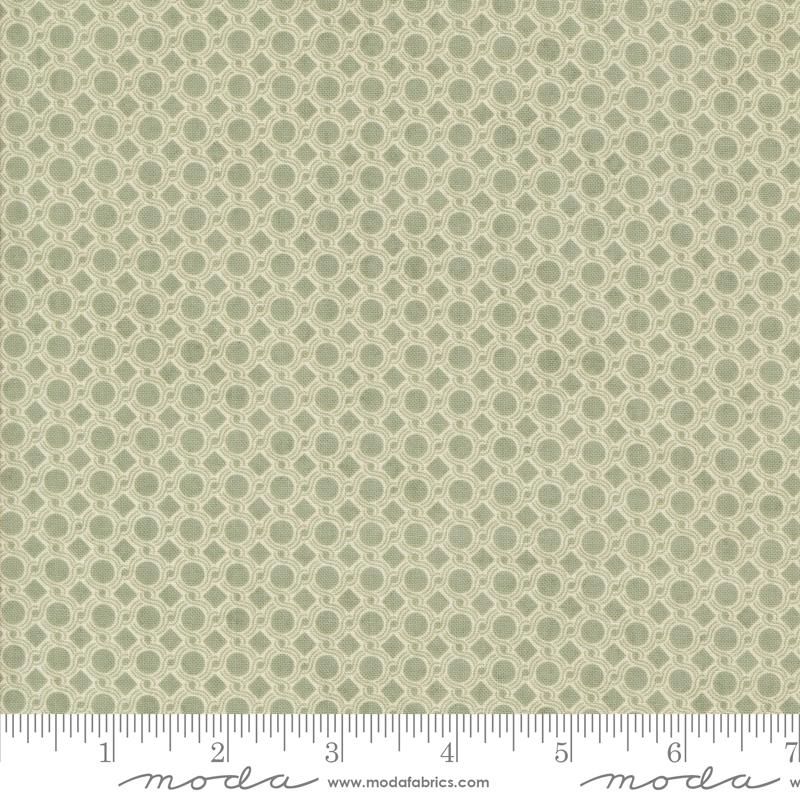 a repeating pattern of green circles on a fabric surface.
