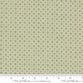 a repeating pattern of green circles on a fabric surface.