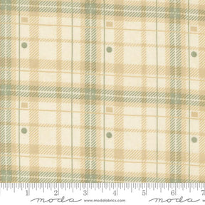 a fabric with a plaid pattern in shades of beige and green. The fabric appears to be a textile, possibly used for clothing or home decor.