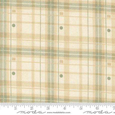 a fabric with a plaid pattern in shades of beige and green. The fabric appears to be a textile, possibly used for clothing or home decor.