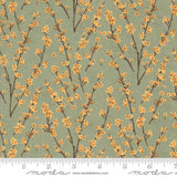a repeating pattern of small orange flowers on brown branches against a light green background.