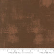 The image is a close-up of a brown fabric with a textured, distressed appearance.