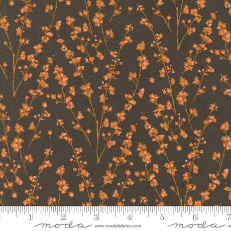 a repeating pattern of orange flowers on a dark background.
