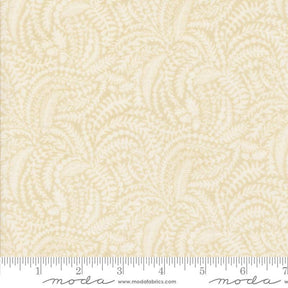 The image is a fabric with a repeating pattern of leaves or ferns in various shades of beige.
