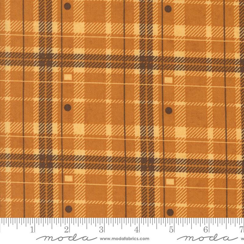a close-up view of a fabric with a plaid pattern in shades of brown and orange. The fabric appears to be made of a material with a grid-like texture, which is commonly associated with plaid patterns. The image does not contain any text or other discernible objects or actions.