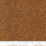 The image is a close-up of a fabric with a repeating pattern of brown leaves and acorns. The pattern is intricate and detailed, creating a visually appealing design.