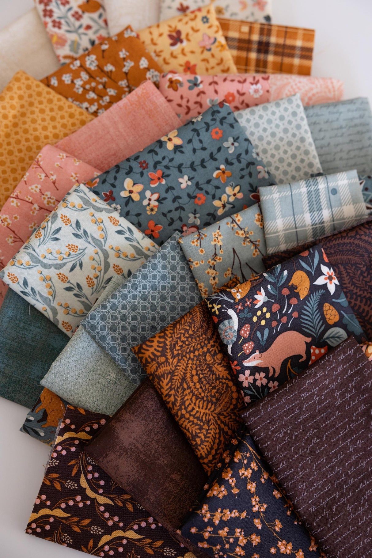 The image is a collage of various fabric swatches, each with different patterns and colors, arranged in a visually appealing manner.
