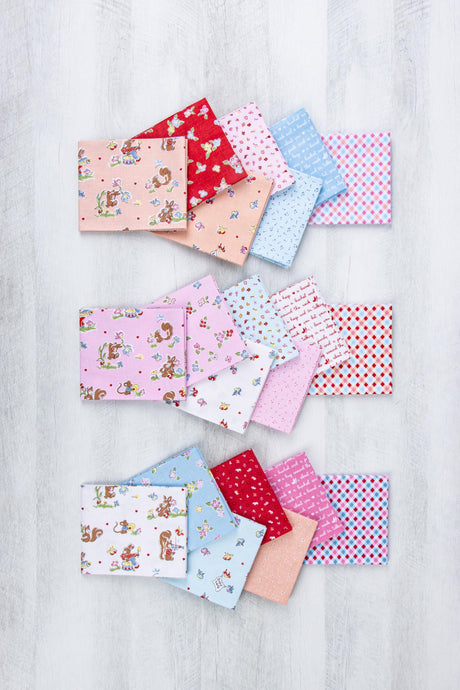 A collection of colorful fabric squares with various patterns, including animals, flowers, and geometric designs, arranged in a visually appealing manner.