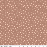 a repeating pattern of small white dots on a brown background.
