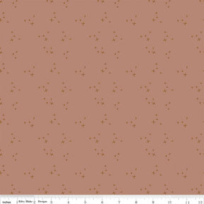 The image is a repeating pattern of small brown stars on a light pink background.