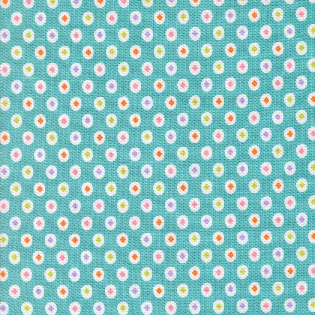 a pattern of small white and colorful circles on a light blue background.