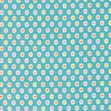 a pattern of small white and colorful circles on a light blue background.