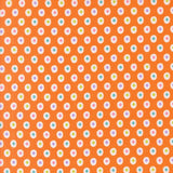 a repeating pattern of small white and orange circles on an orange background.