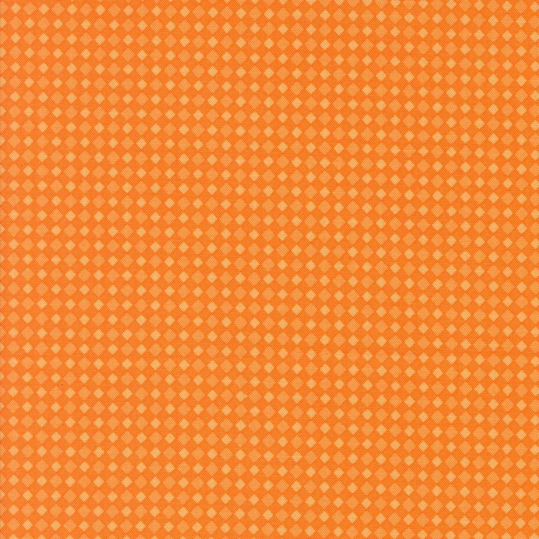 a repeating pattern of small orange and yellow squares, creating a visually striking and vibrant design.