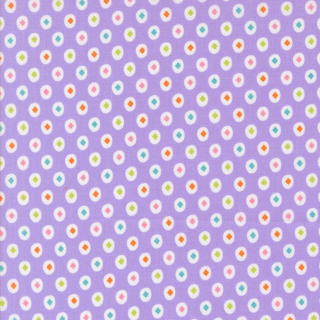 a pattern of small white and purple circles arranged in a diagonal grid on a purple background.
