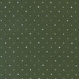 a green background with white polka dots