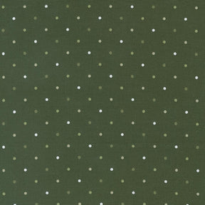 a green background with white polka dots