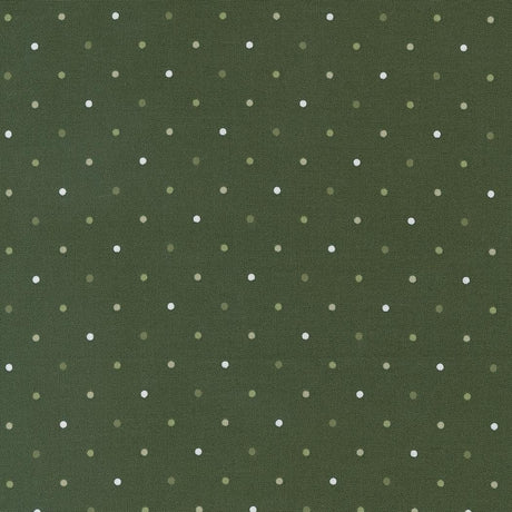 a green background with white polka dots