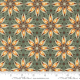 a repeating pattern of stylized orange and brown flowers on a green background, with a ruler for scale.