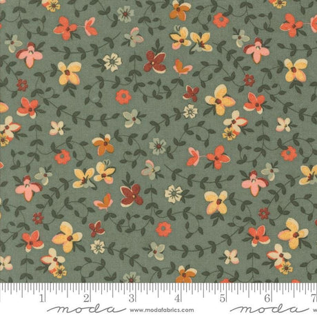 The image is a fabric with a floral pattern, featuring various shades of green, orange, and yellow flowers and leaves. The fabric appears to be a textile or material with a repeating floral design.
