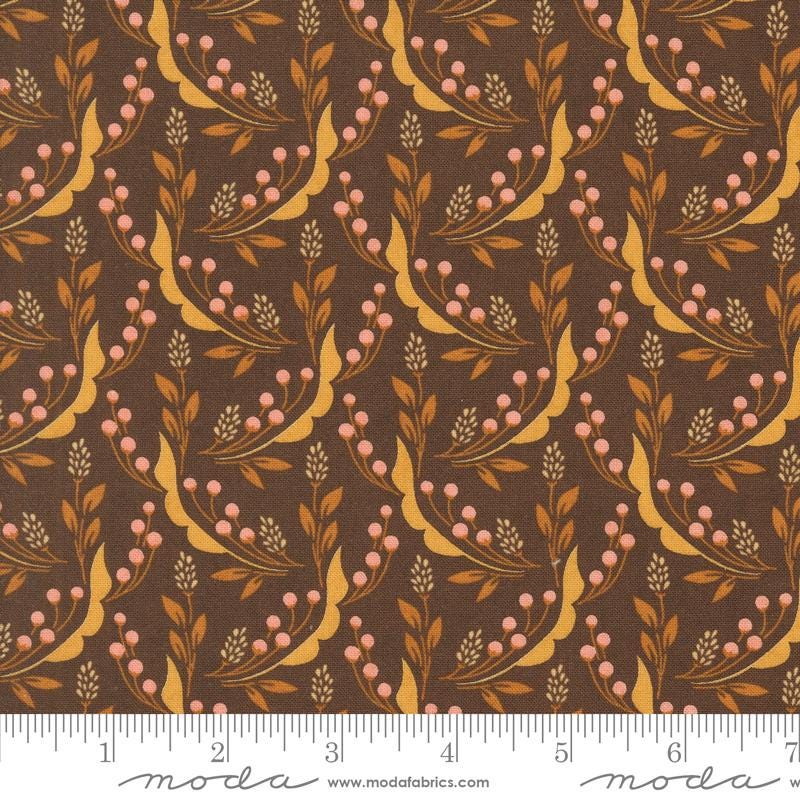 a repeating pattern of brown leaves and flowers on a dark background, creating a visually appealing and intricate design.