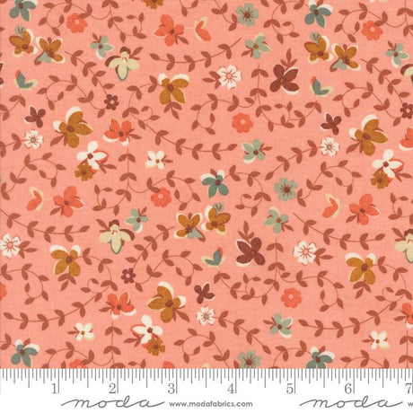 The image is a fabric with a floral pattern in shades of pink and orange. The pattern consists of various flowers and leaves in different colors, creating a visually appealing and textured design.