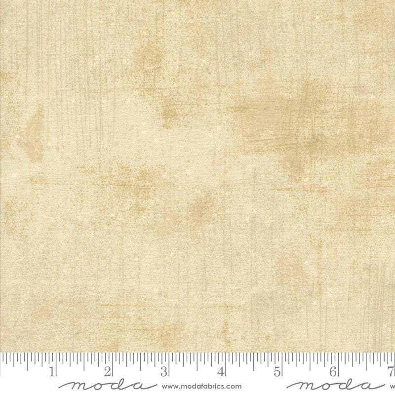 The image is a plain beige fabric with a textured appearance.