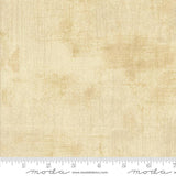 The image is a plain beige fabric with a textured appearance.