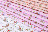 a collection of fabric swatches with various patterns and designs, including animals, flowers, and other decorative elements.