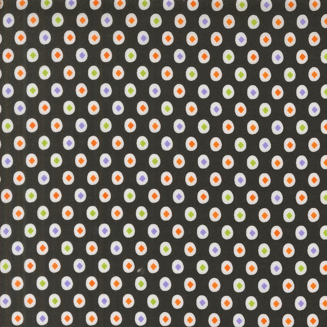 a repeating pattern of small white and orange circles on a dark background.