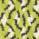 a repeating pattern of black bat silhouettes against a green and white geometric background.