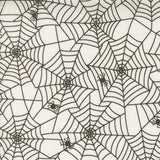 a repeating pattern of black and white spider web designs.