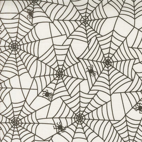 a repeating pattern of black and white spider web designs.