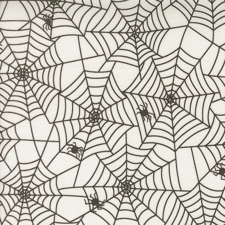 a repeating pattern of black and white spider web designs.