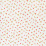 a repeating pattern of small pink flowers on a white background.