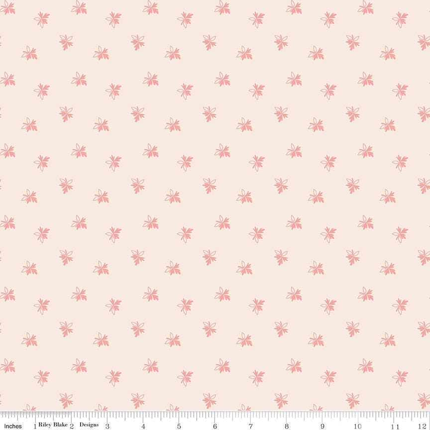 a repeating pattern of small pink flowers or leaves on a light peach background.