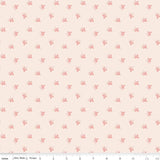 a repeating pattern of small pink flowers or leaves on a light peach background.